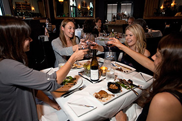 Diners toasting the good life at Wine Cask, Santa Barbara, where chef Brandon Hughes plunders the weekly farmers’ market DR003