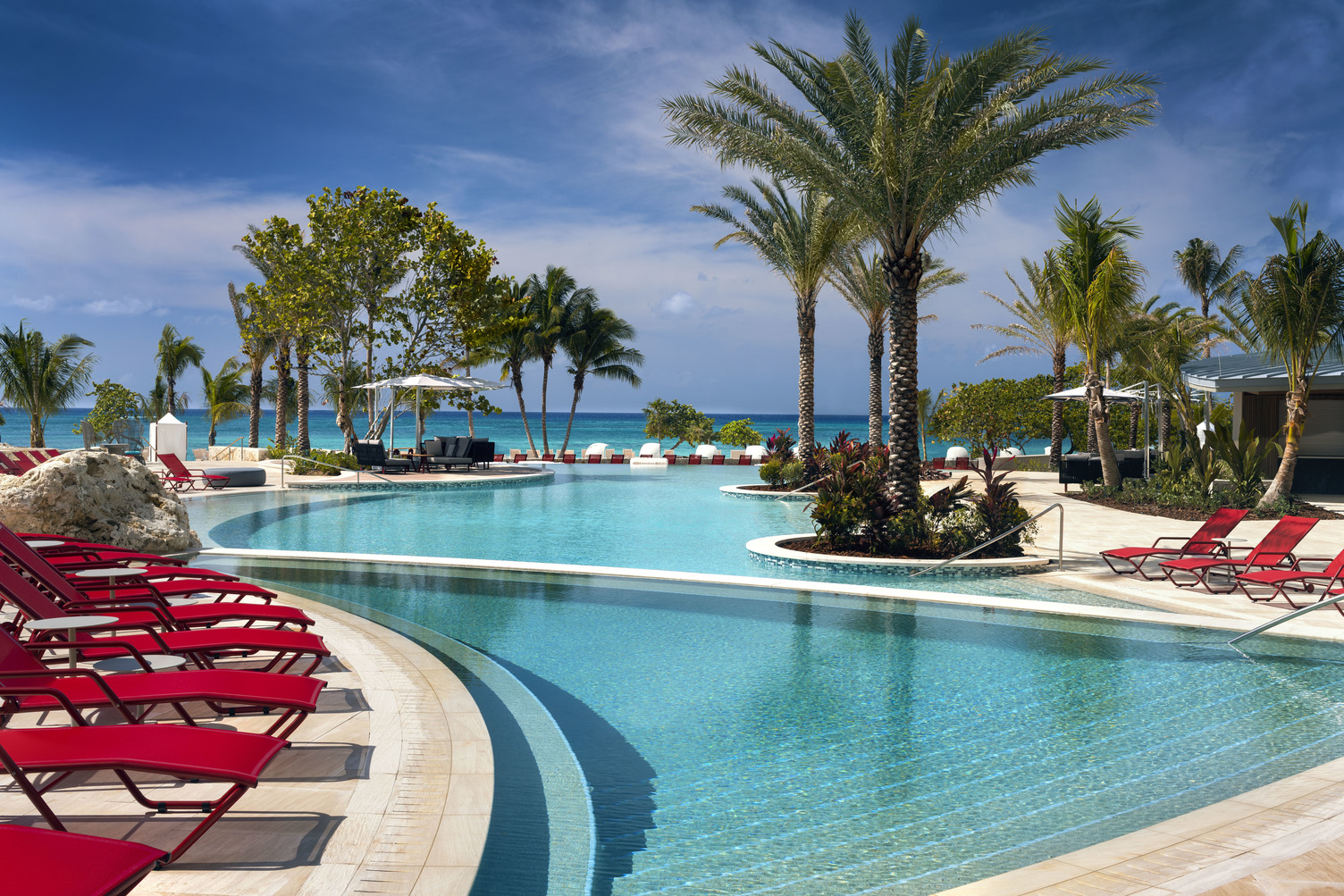 Poolside views at the Kimpton Seafire Resort + Spa Caribbean dream: Nature meets luxury in the Cayman Islands
