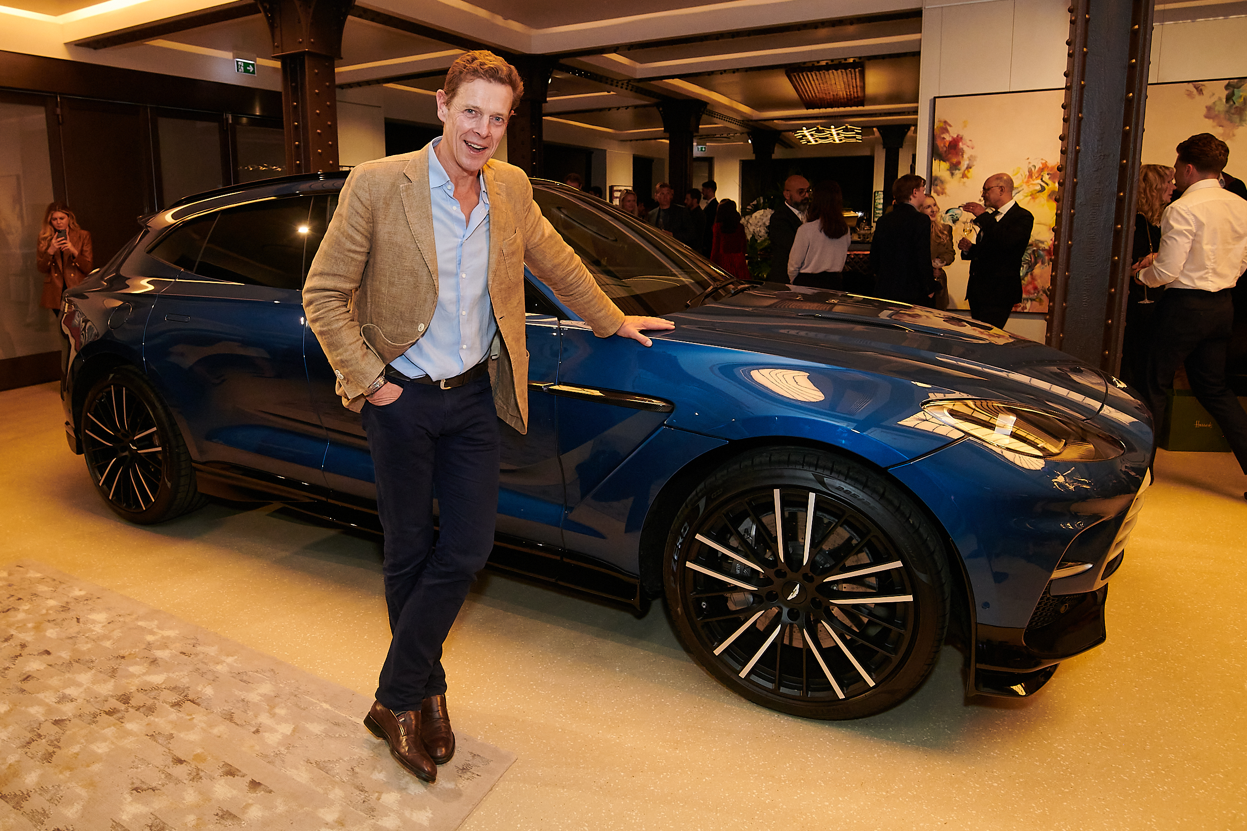 James Ogilvy with the Aston Martin DMX707