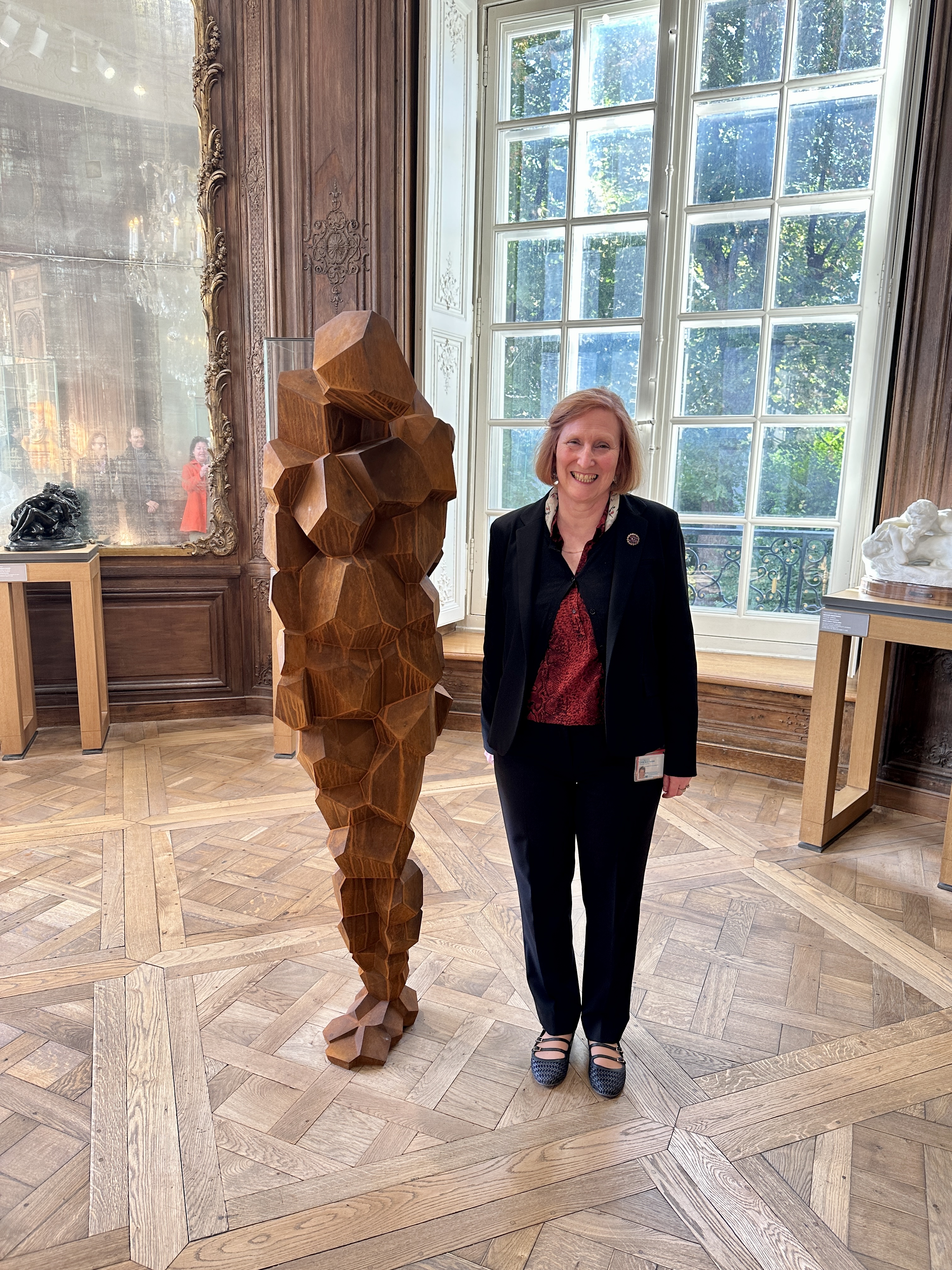 Exhibition Curator Sophie Biass-Fabiani with Antony Gormley sculpture