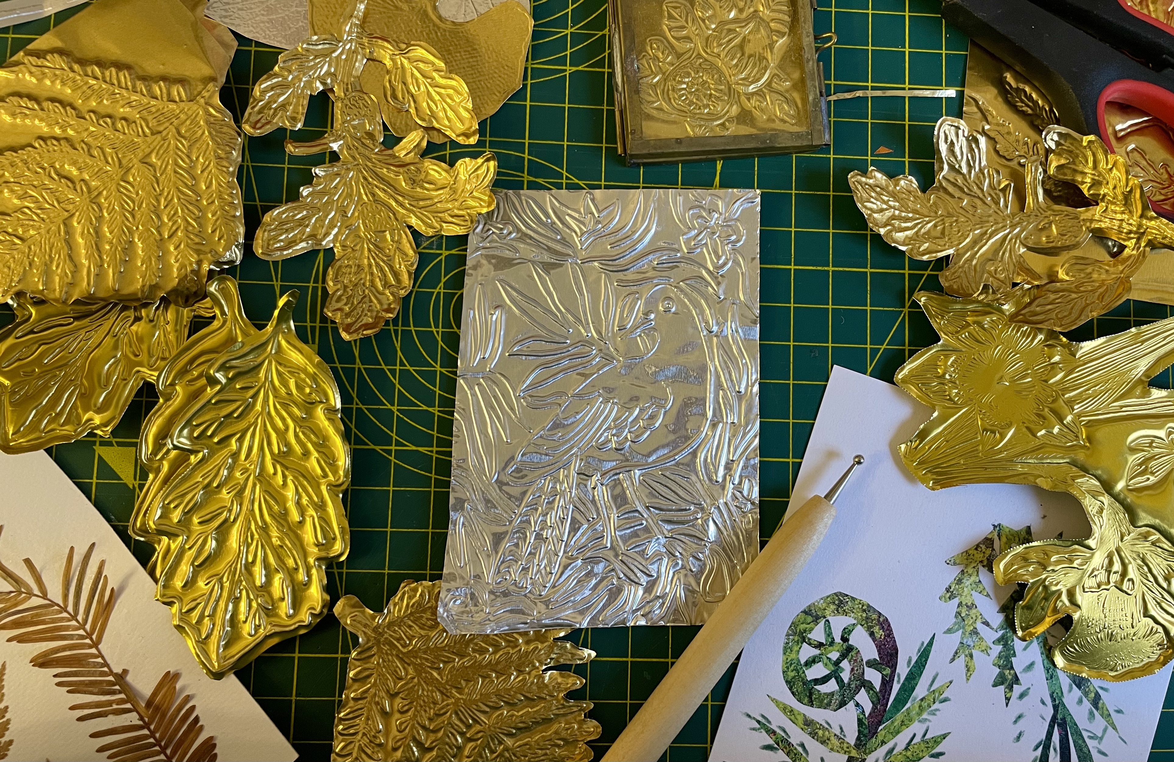 Natural History Museum - gold and silver tins with embossed leaves