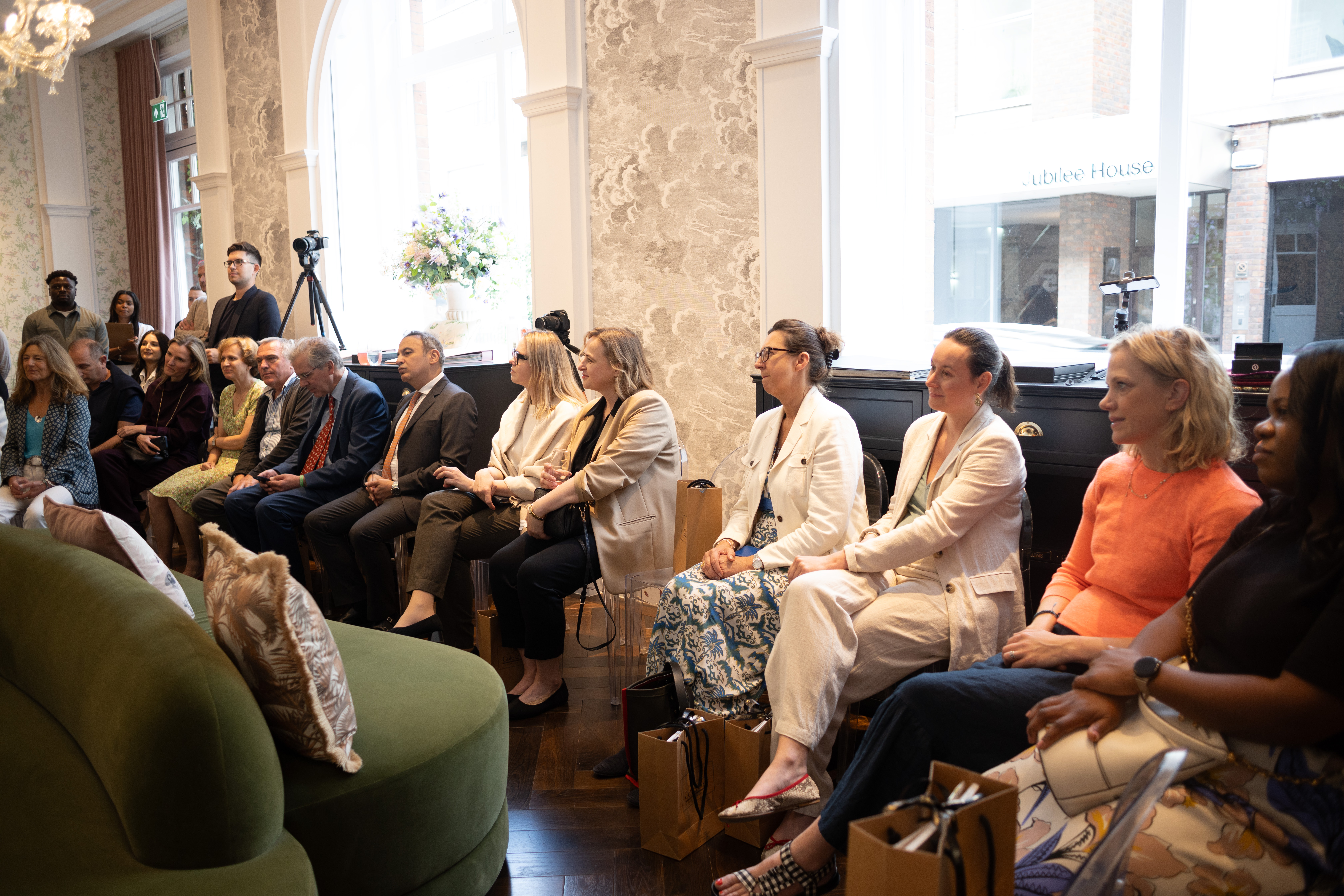 Cole & Son - people listening to a talk