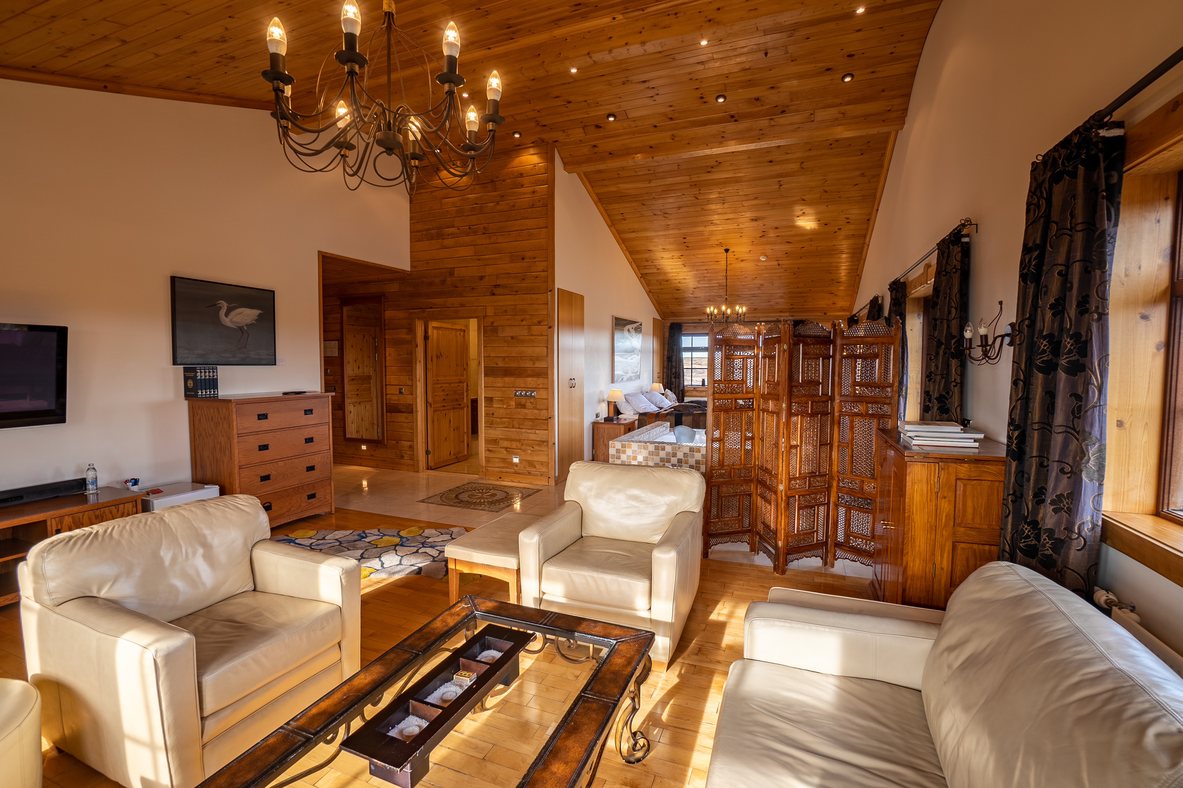 The Royal Master Suite at Hotel Rangá - wooden and cream leather designed room