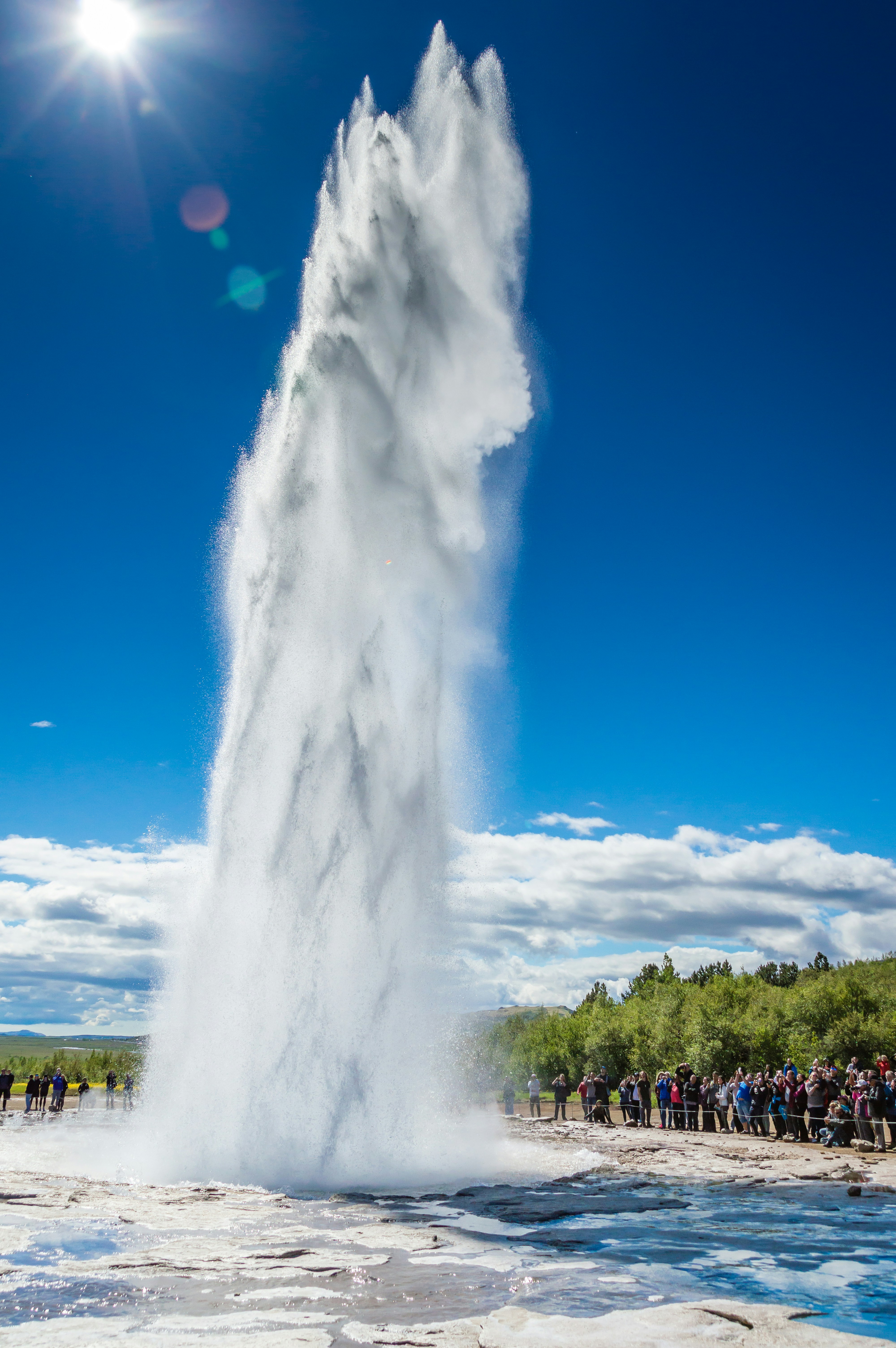 Strokkur - a hot spring erupting and water bursting into the air