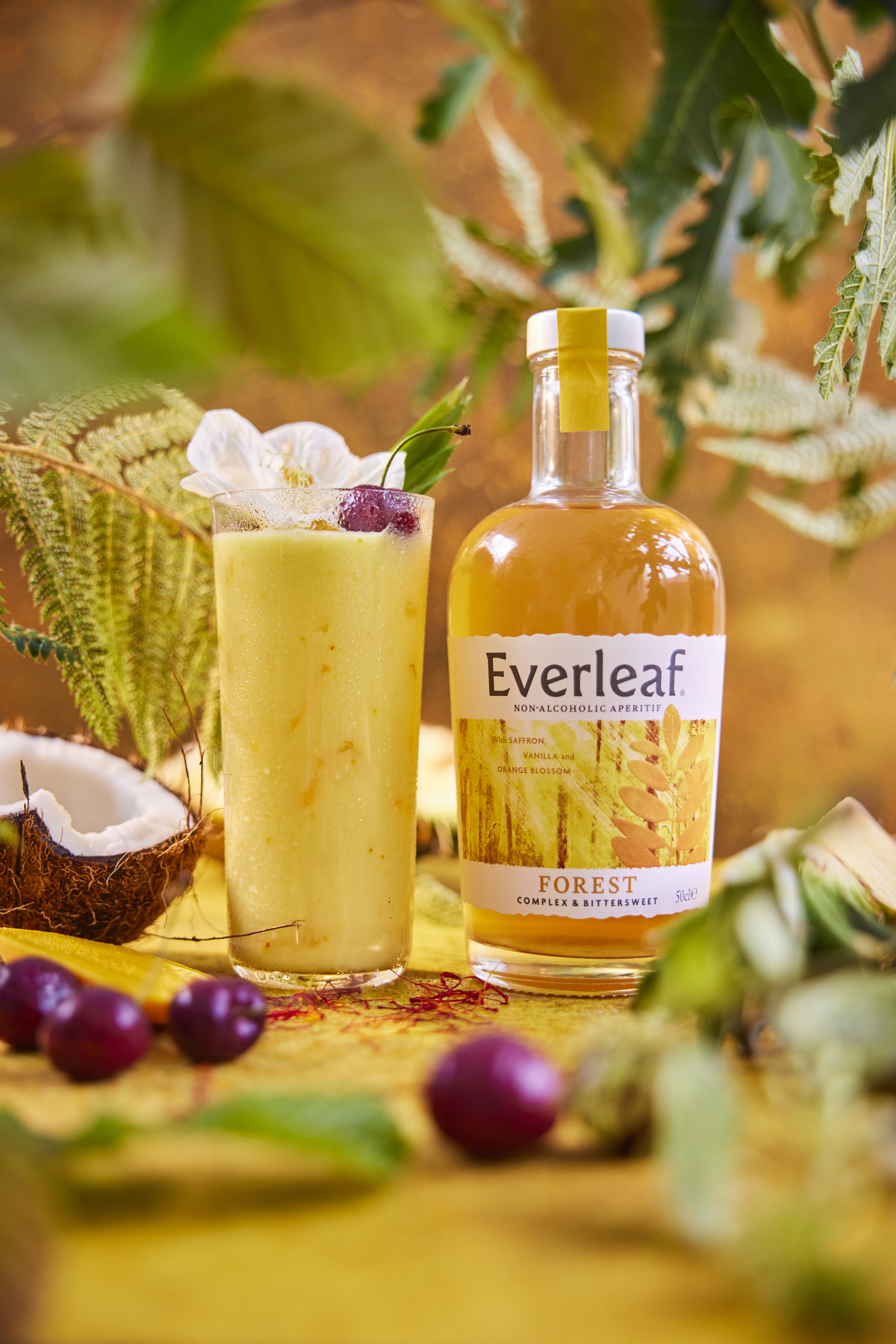 luxury non alcoholic spirits - a pina colada and a bottle of everleaf forest