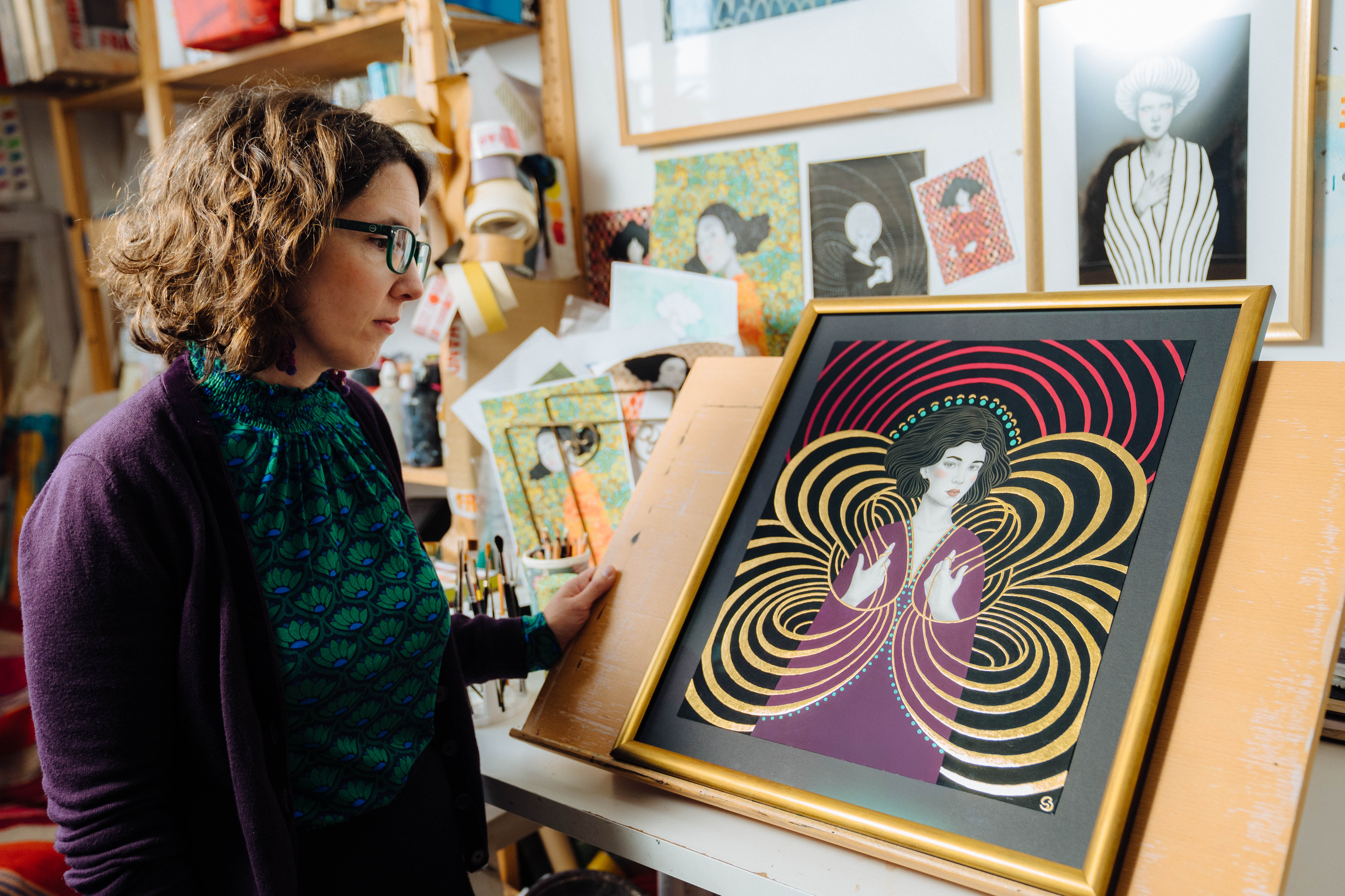 Compass Box Hedonism 2025 - Artist sofia bonati sat beside a painting of a woman