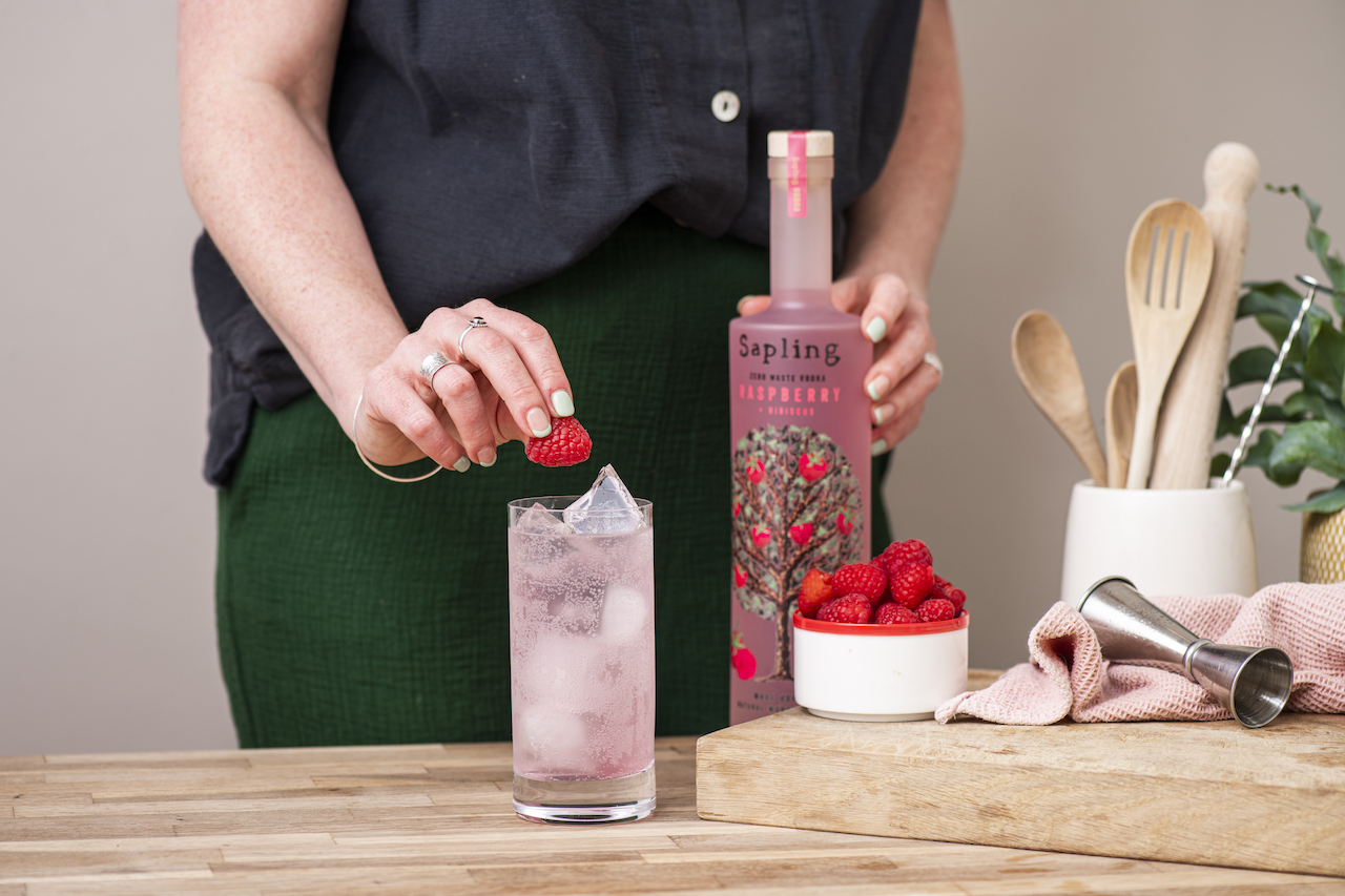 Alternative Valentine's Day London Experiences - a person preparing a cocktail using the Sapling Raspberry and Hibiscus Vodka