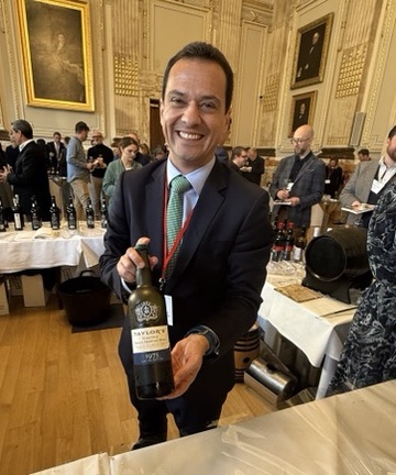 Mentzendorff Annual Tasting - João Vasconcelos holding a bottle of Taylor's Port