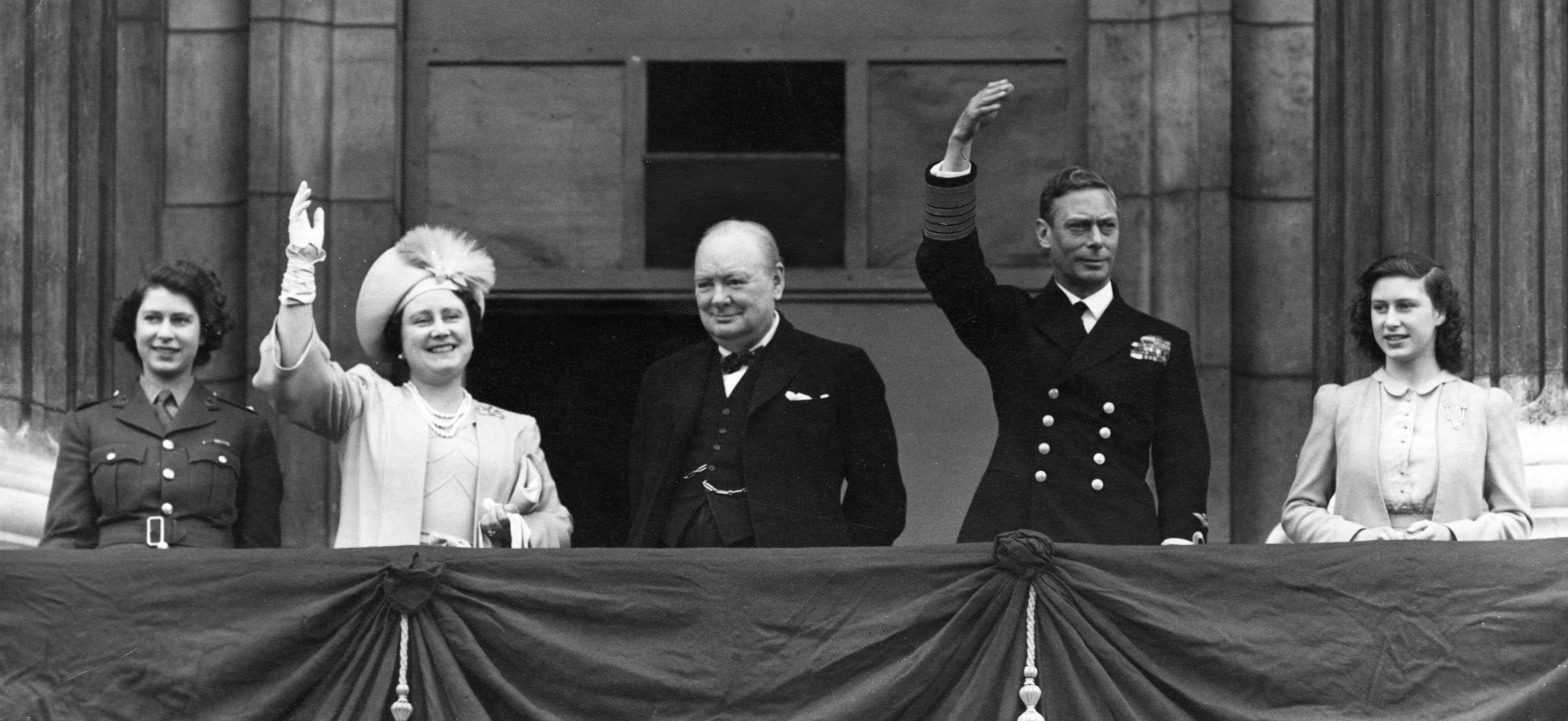 An image of The King and Queen, with Princesses Elizabeth and Margaret and Winston Churchill on VE Day, now celebrating its 80th Anniversary.