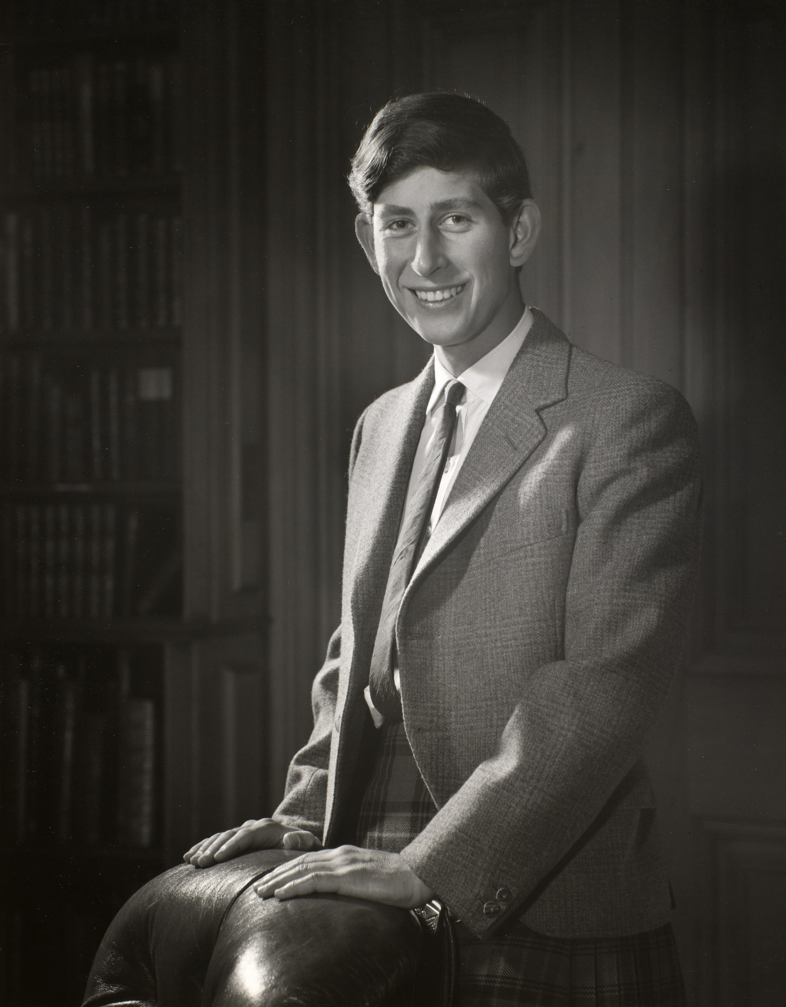One Hundred Years of Royal Photographs - A 1966 portrait of the then-Prince of Wales by Godfrey Argent, taken in the library at Balmoral Castle to commemorate his 18th birthday