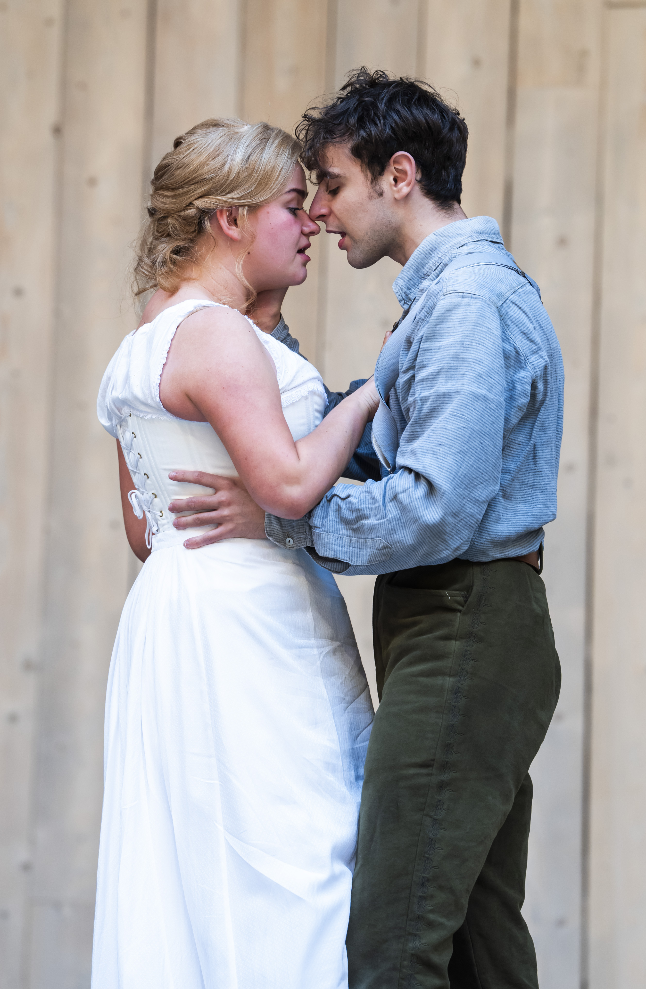 Lola Shalam as Juliet and Rawaed Asde as Romeo embracing in Romeo and Juliet at Shakespeare's Globe