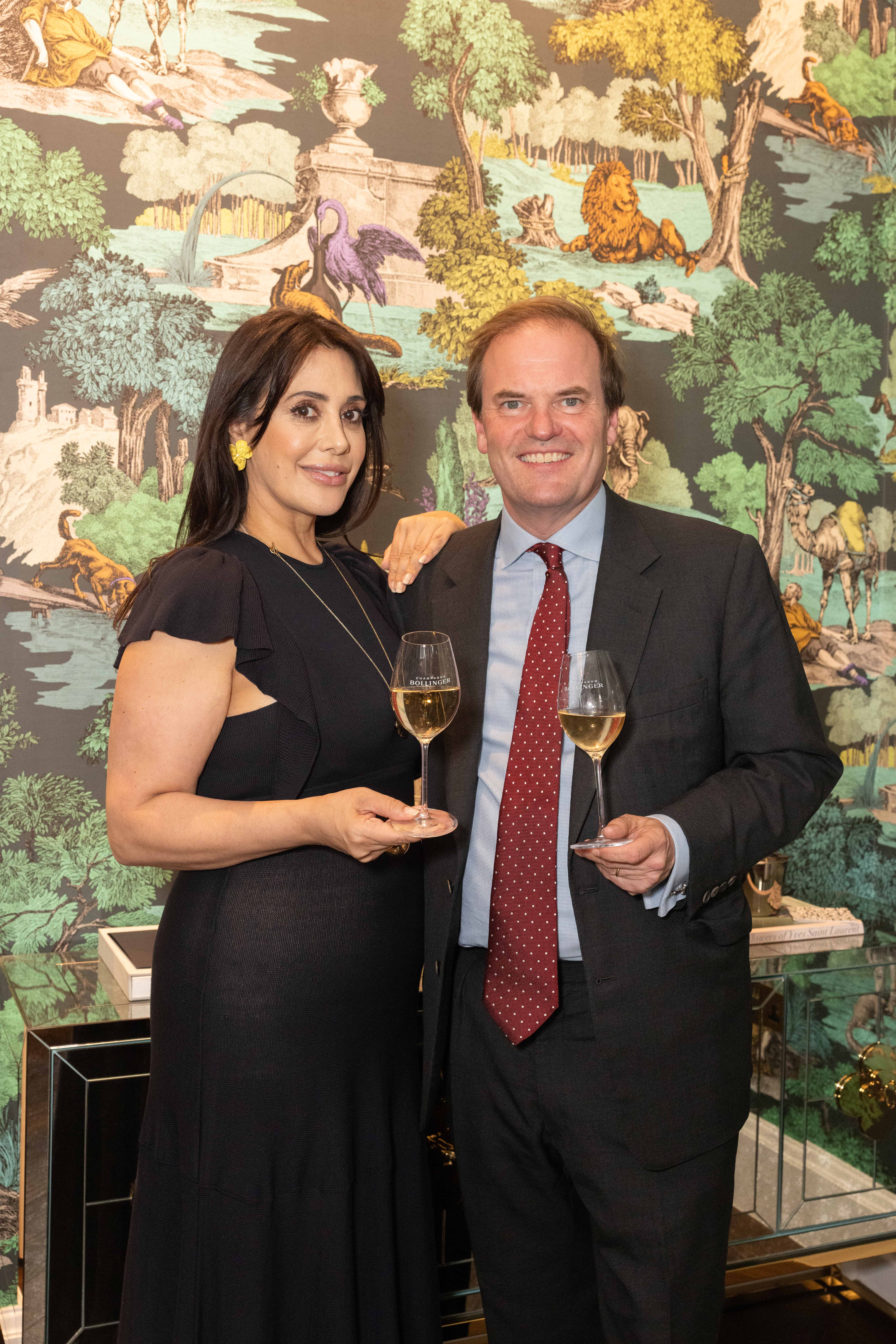Marie Karlsson and Harry Dalmeny at the Cole and Son tastemakers event with a glass of Bollinger