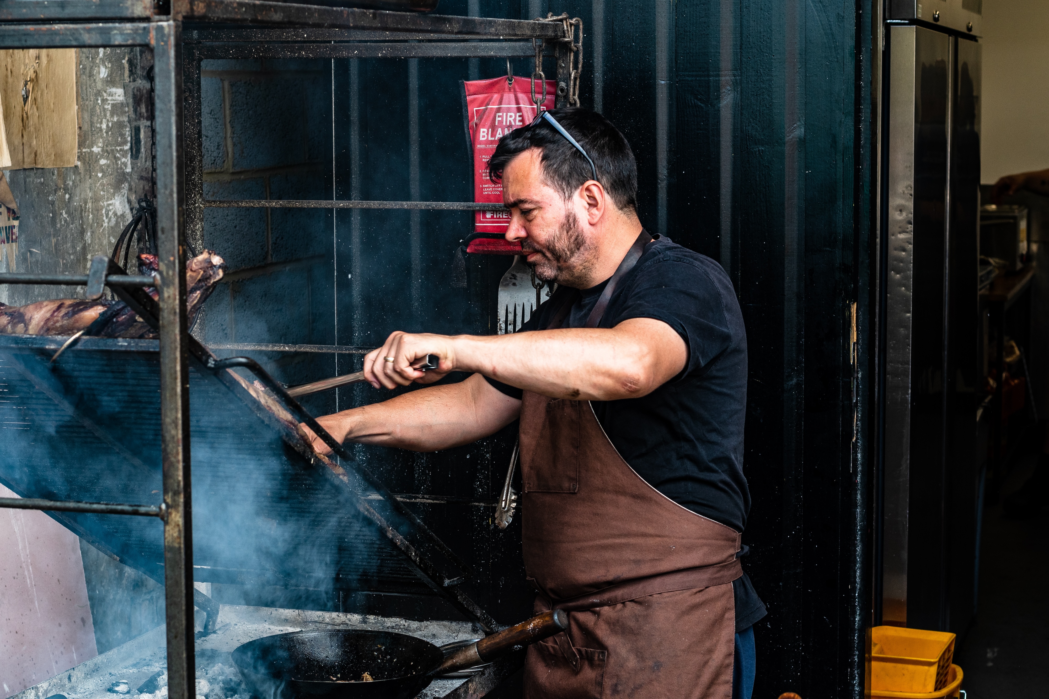 Open-fire cooking at From the Ashes, renowned restaurant.