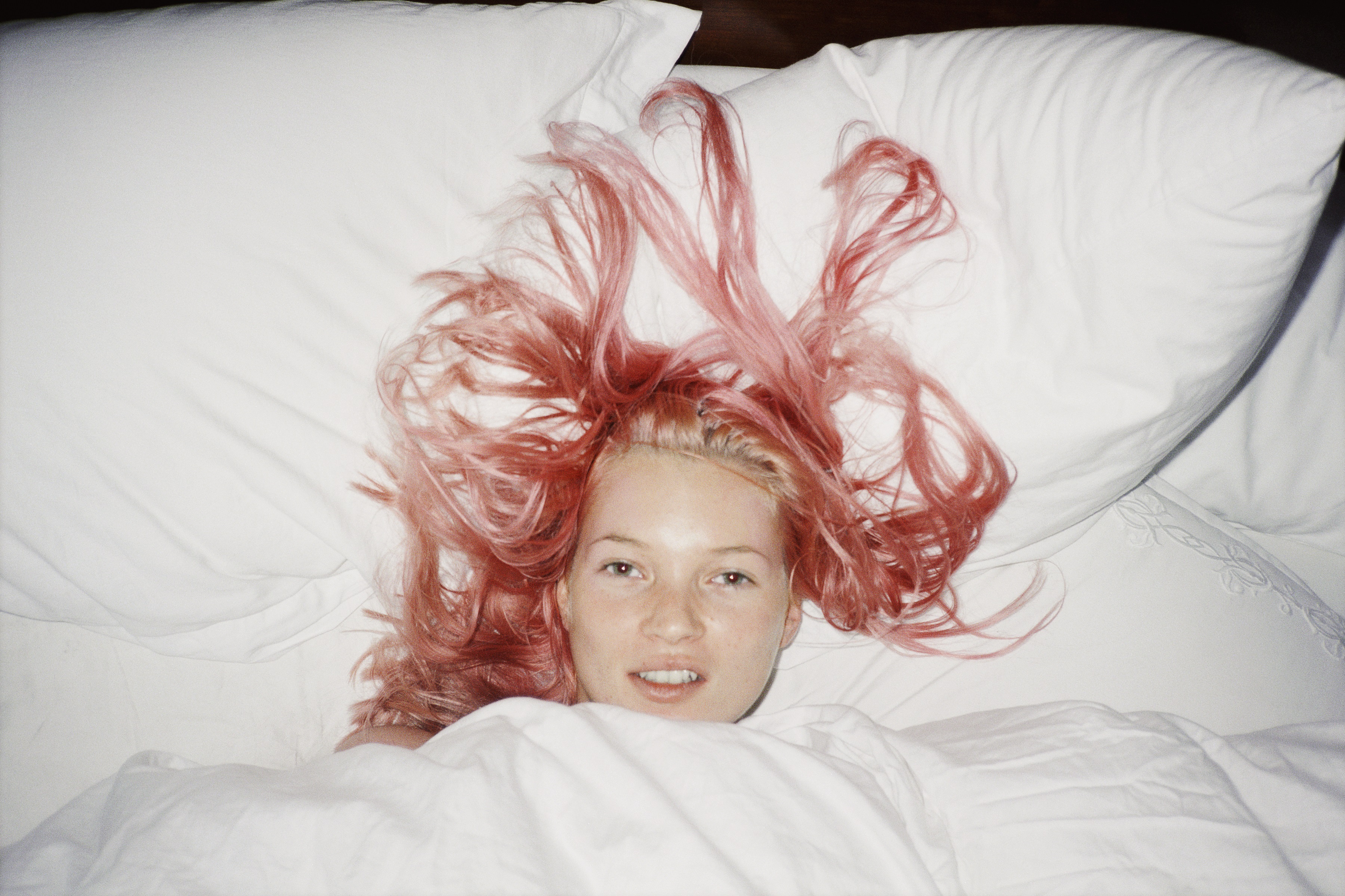 Young Kate Moss with pink hair, fashion exhibitions 2026. 